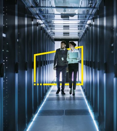 ey-female-male-server-engineer-data-center-hallway